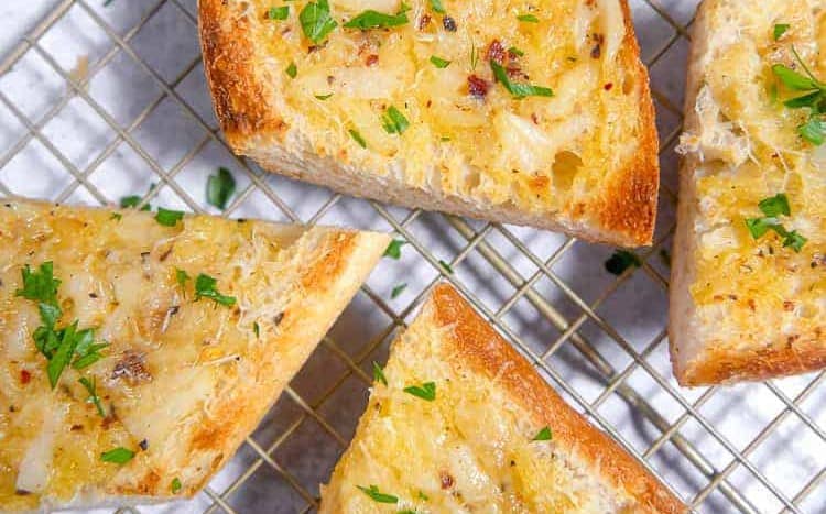 close up of garlic butter spread on bread