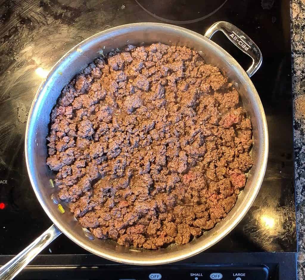 browned ground beef in a skillet 