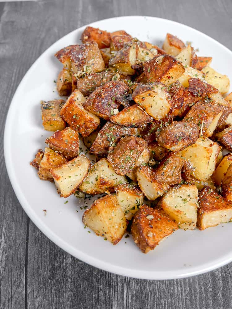 roasted potatoes on a white plate