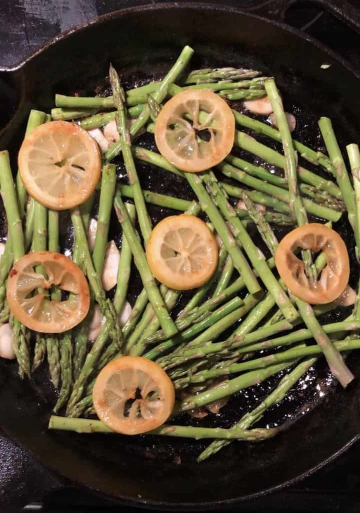 asparagus lemons garlic in cast iron skillet