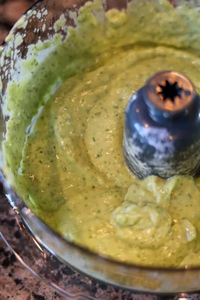 blended avocado crema in a food processor