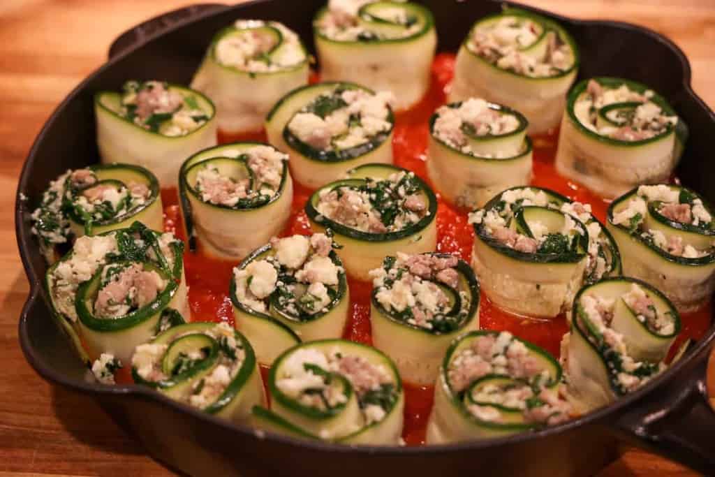 zucchini rolls stuffed pre-oven in cast iron skillet
