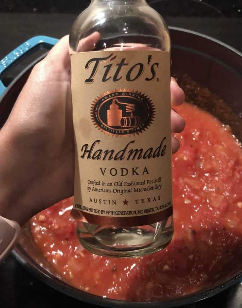 bottle of vodka over the sauce in the dutch oven 