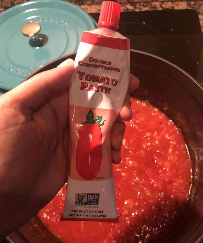 tube of tomato paste over the dutch oven 