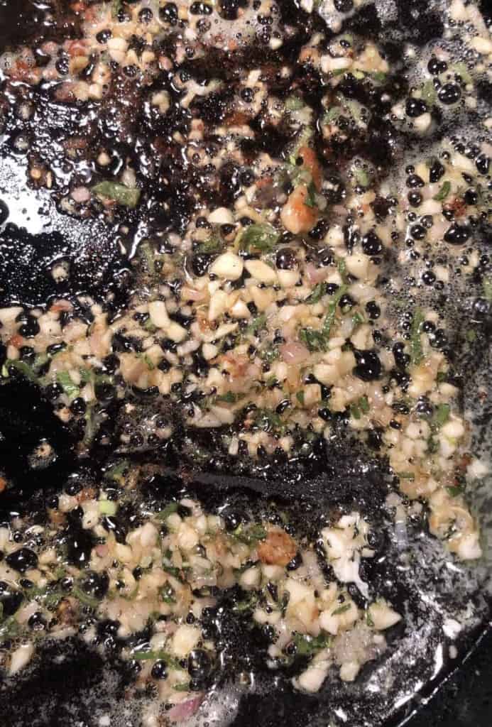 sautéd shallot, sage, and garlic in a cast iron pan