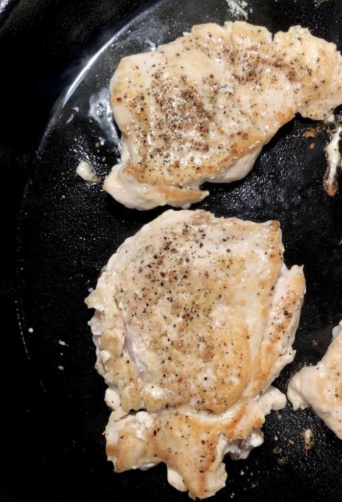 seared chicken breast in a cast iron skillet