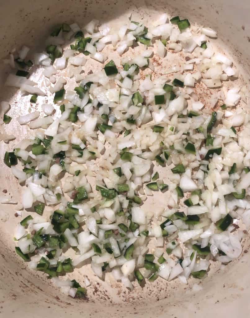 diced onion and poblano pepper in a dutch oven