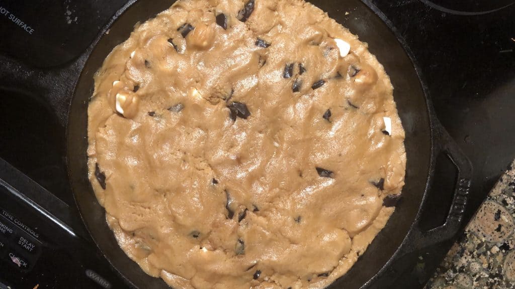 cookie dough covering s'mores ingredients in skillet