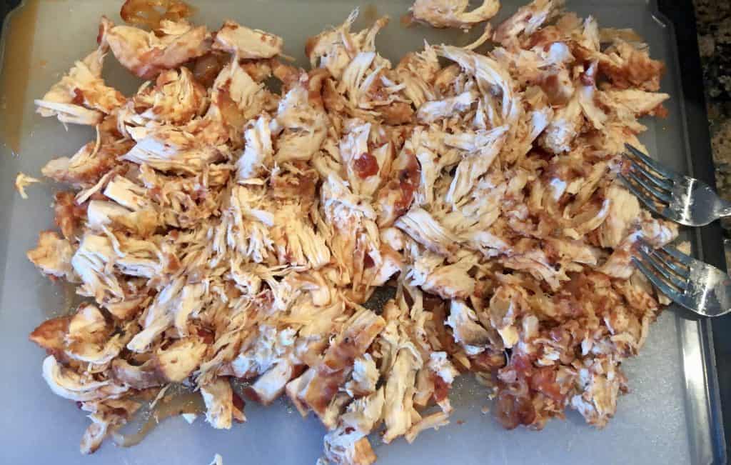 shredded chicken on cutting boards