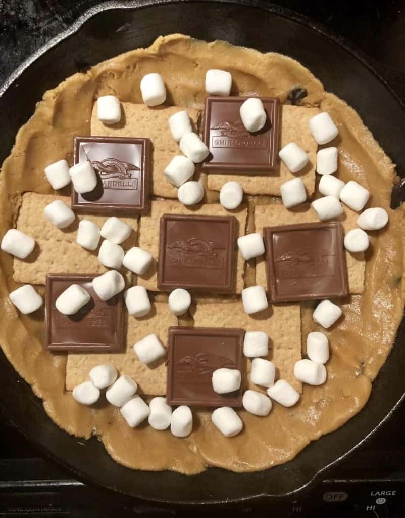 smores stuffing inside of a cast iron skillet
