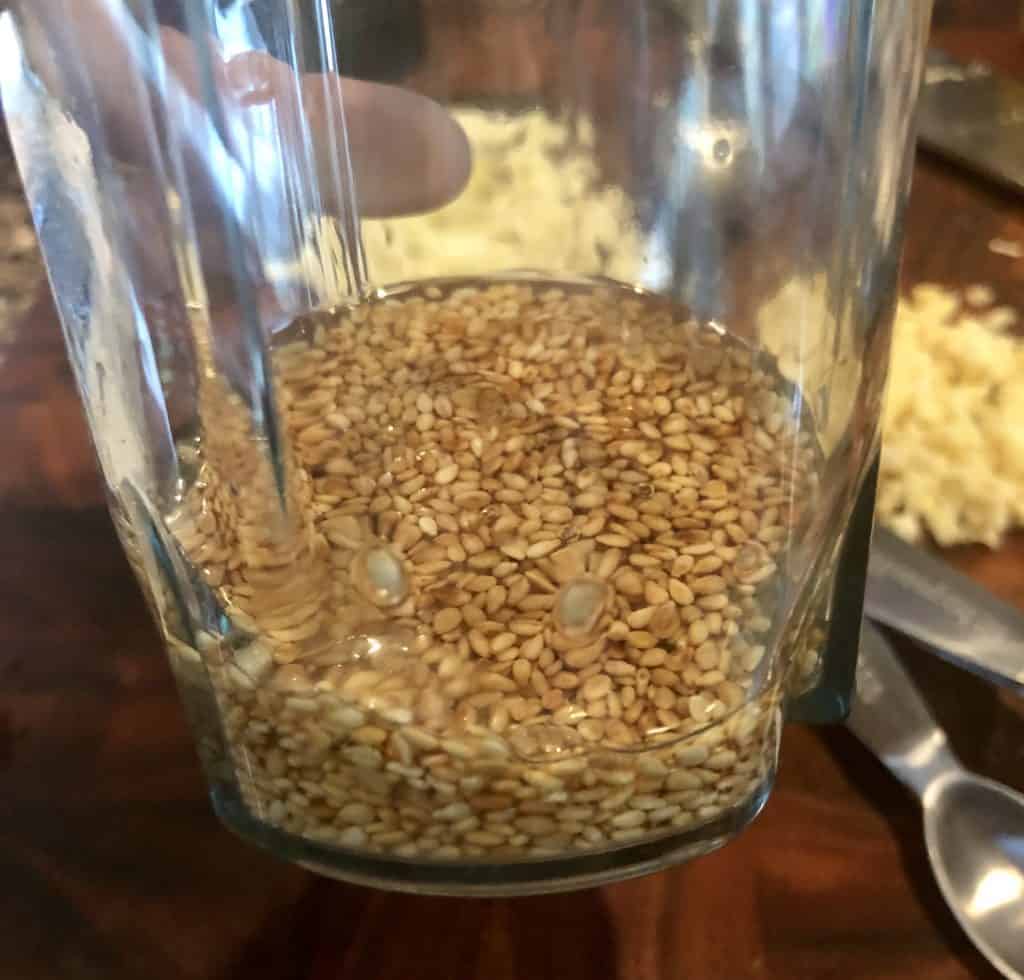 toasted sesame seeds in sesame oil in a blender cup