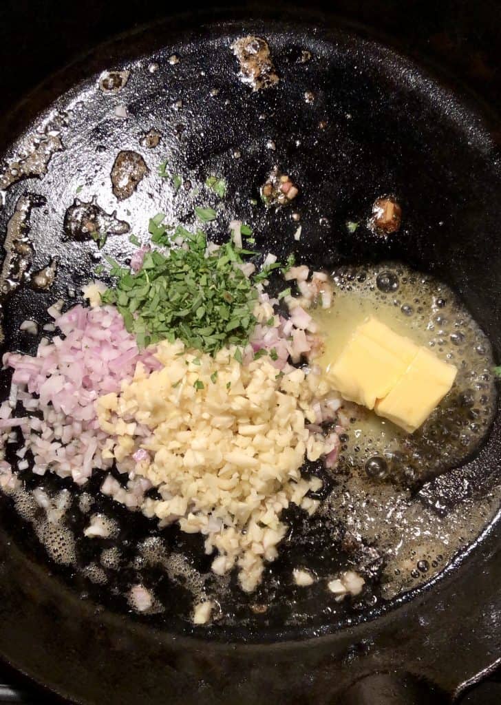 minced garlic, shallot, tarragon, and butter in a cast iron skillet