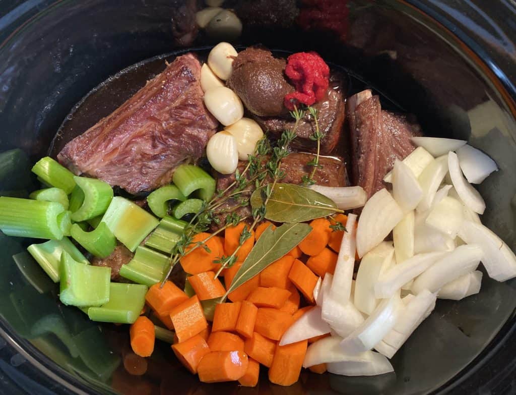 short ribs, carrots, celery, garlic, onion, thyme bay leaves,in a crock pot