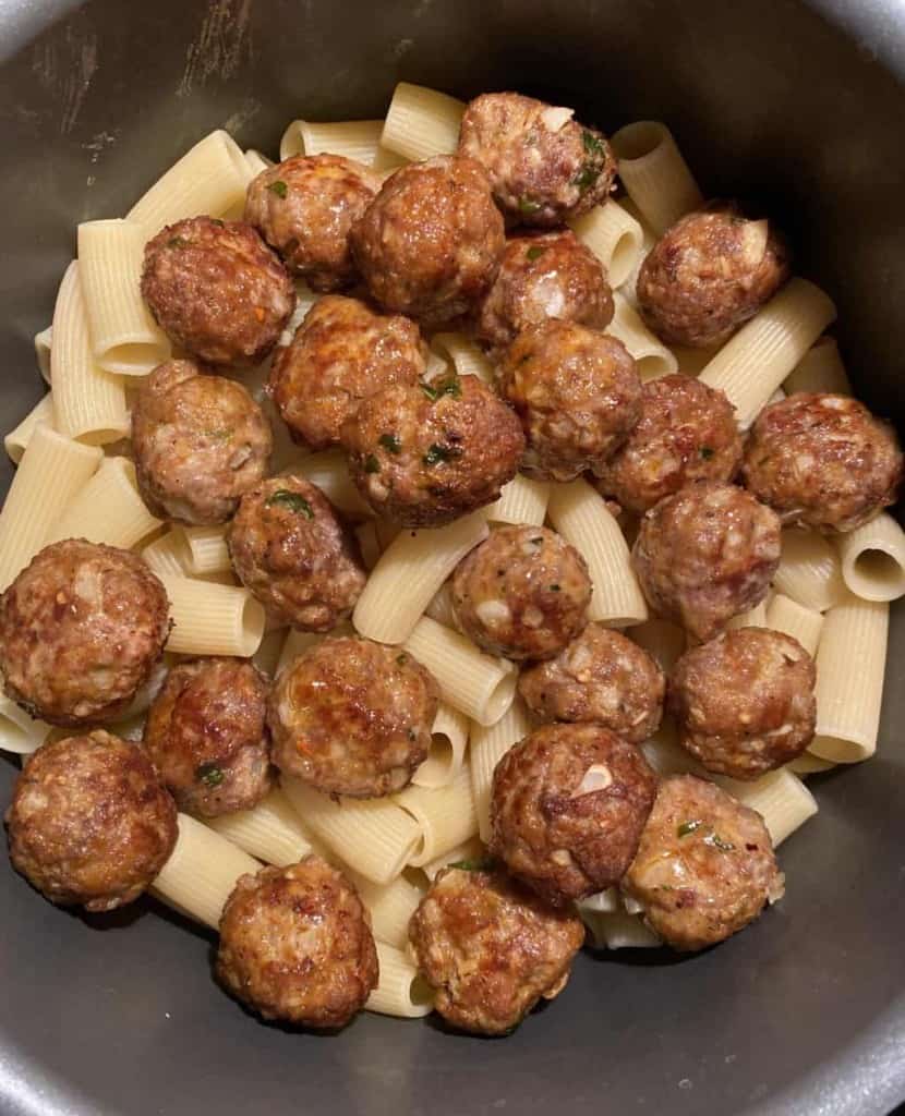rigatoni pasta with meatballs on top