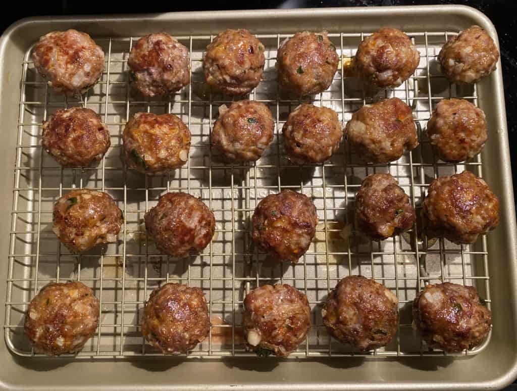seared meatballs on a baking rack