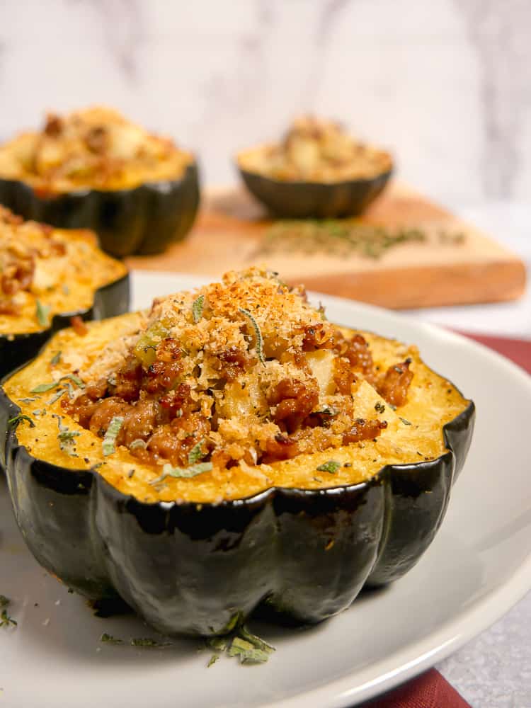 close up of acorn squash stuffed with sausage 