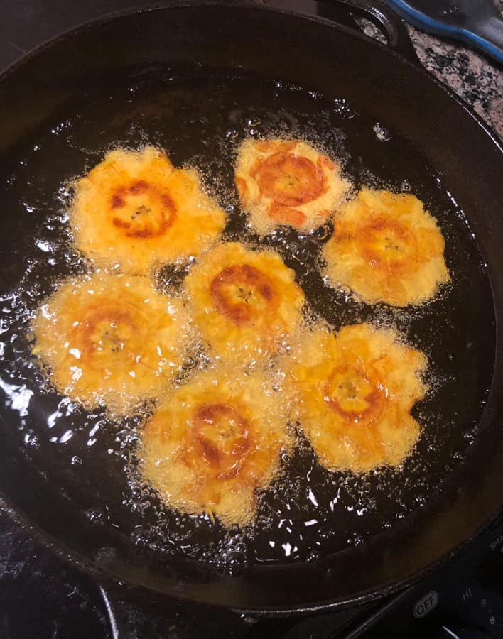 tostones in a cast iron frying