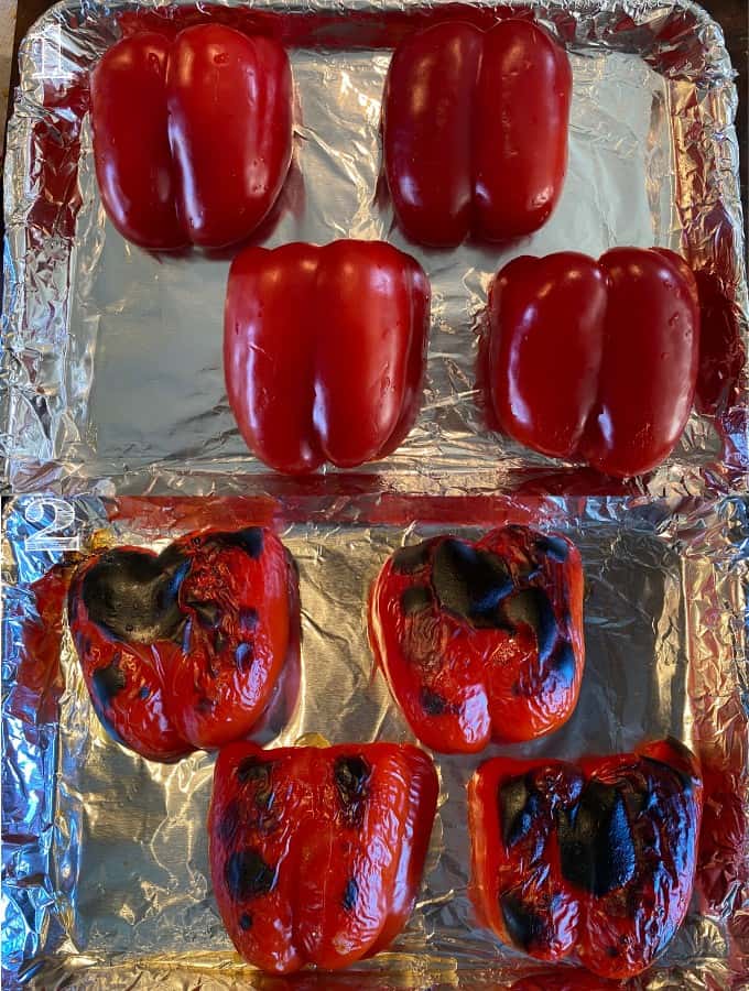 charred bell peppers on a baking sheet