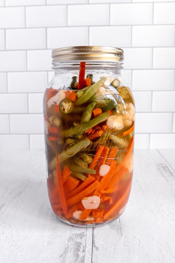 photo of jar of pickled vegetables against white background