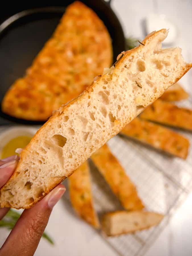 up close photo of slice of focaccia bread 