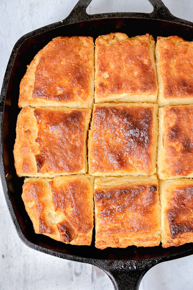 close up square biscuits in cast iron