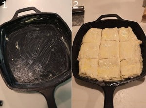 greased cast iron skillet with 9 cut biscuits inside