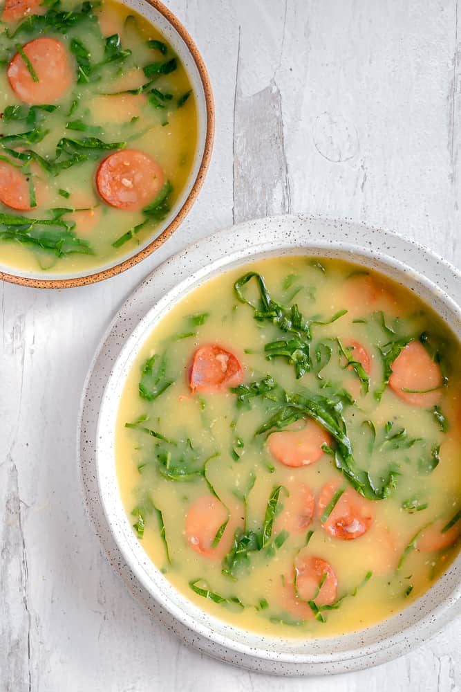 two soup bowls of caldo verde 