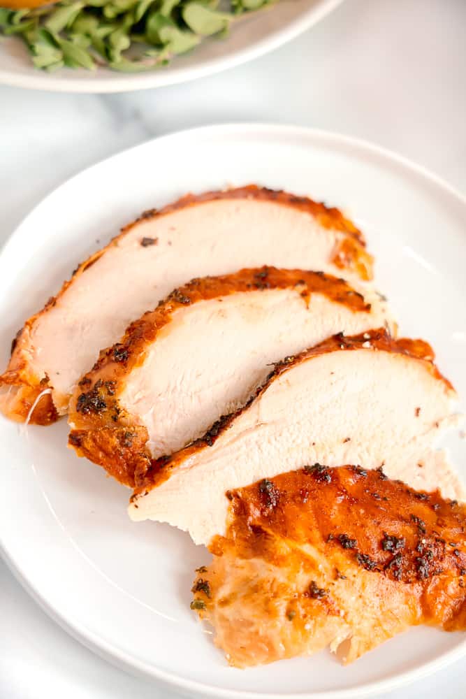 sliced turkey with crispy outer skin on a plate