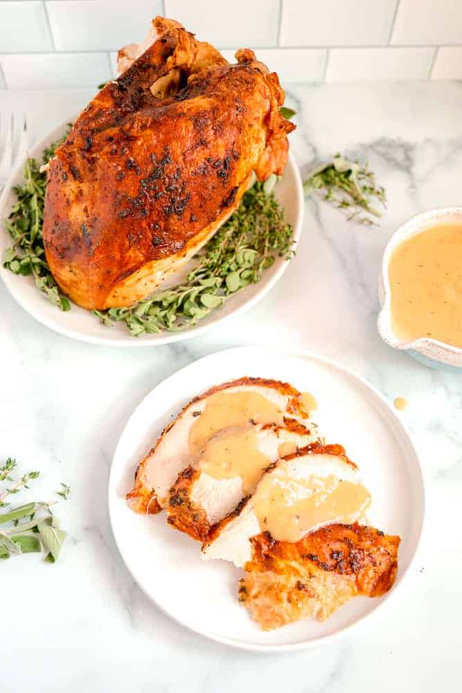 roasted dry brine turkey sliced with gravy over the top