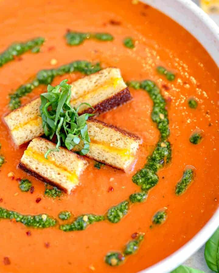 roasted red pepper soup with pistou swirl and grilled cheese croutons