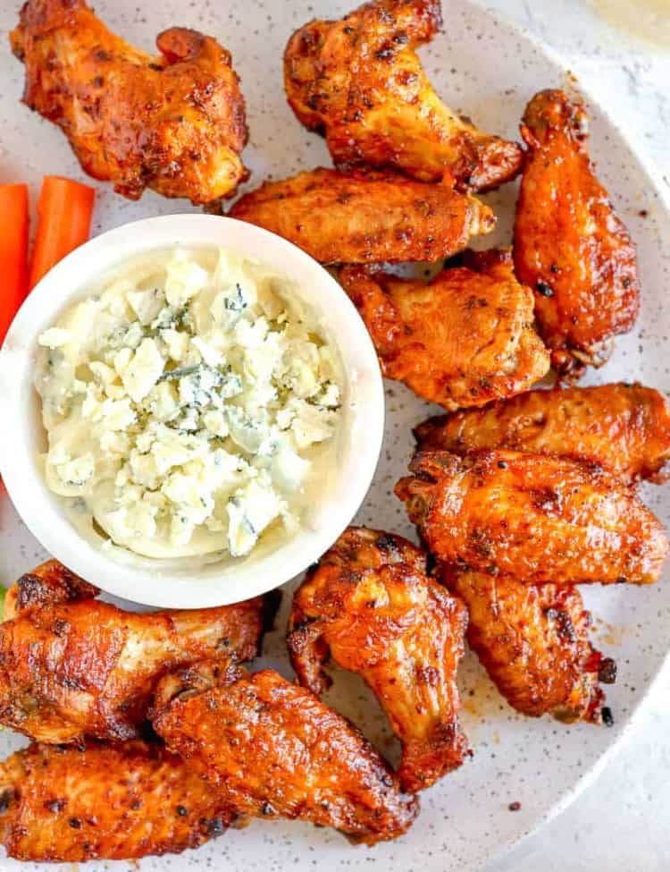 buffalo chicken wings on a plate with blue cheese dipping sauce