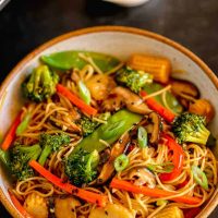 close up of vegetable lo mein in a bowl