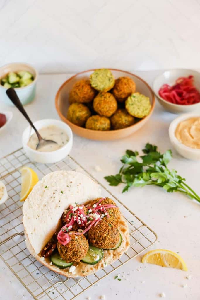 pita filled with falafel, hummus, red onions, lemon, and toppings