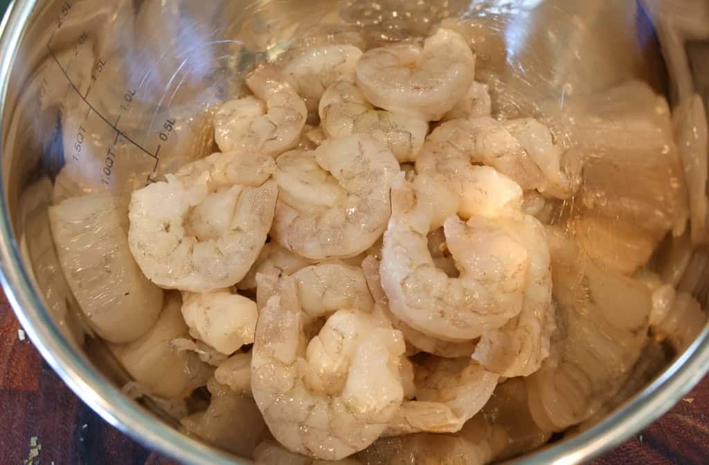 raw shrimp n a metal bowl