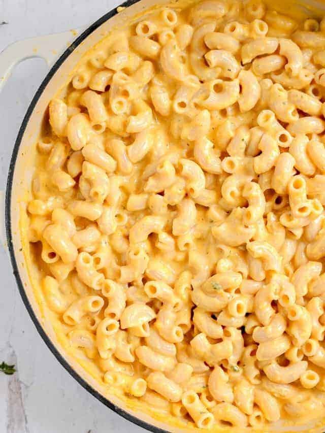 creamy butternut squash mac and cheese in a skillet
