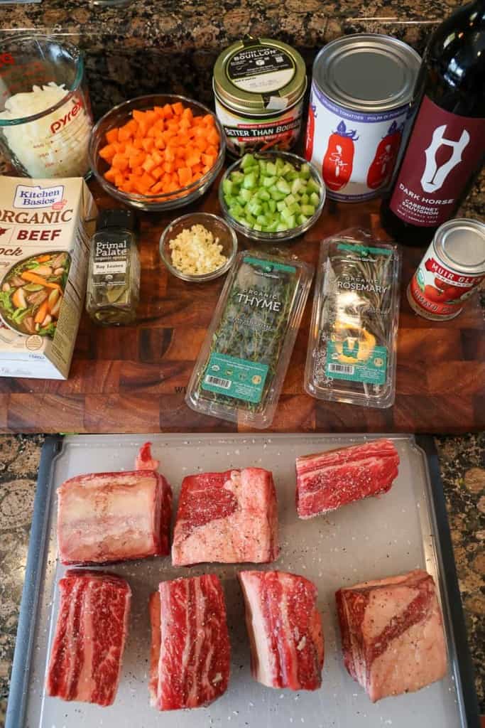 short rib ragu ingredients on a cutting board