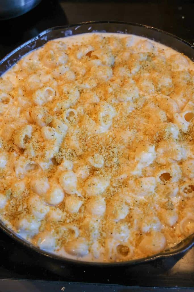 buttered breadcrumbs on top of mac and cheese pre-oven