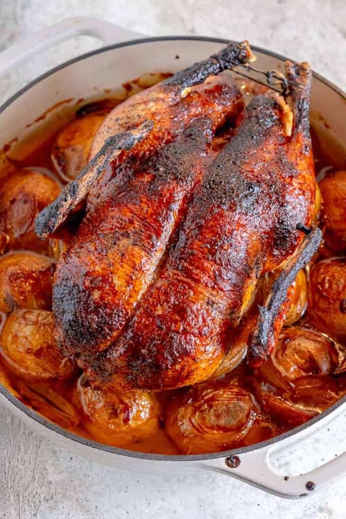 soy ginger glazed whole duck over a bed of roasted duck fat potatoes