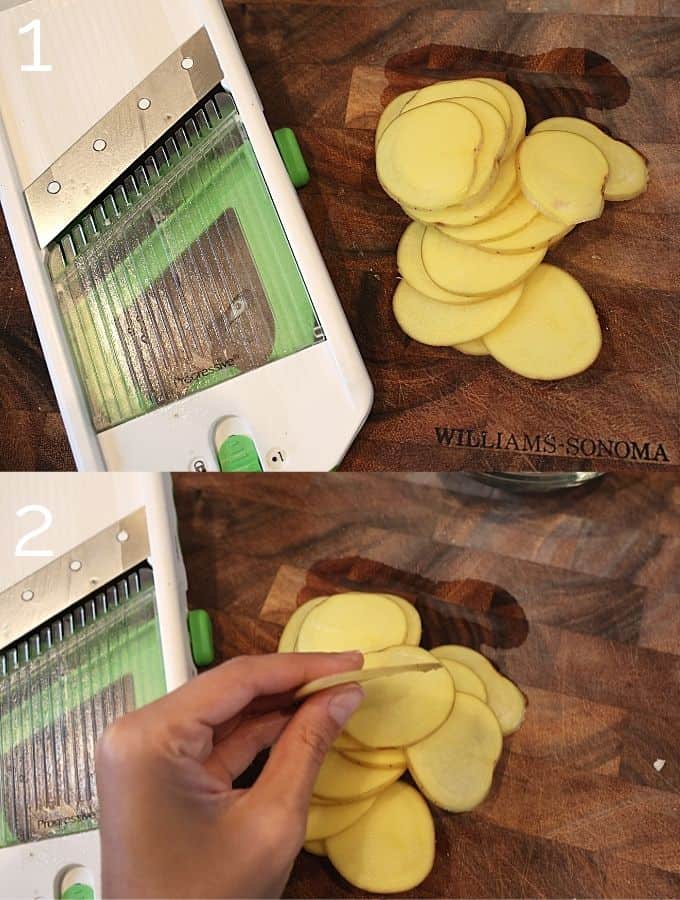 thinly sliced potatoes using a mandoline on a wooden cutting board