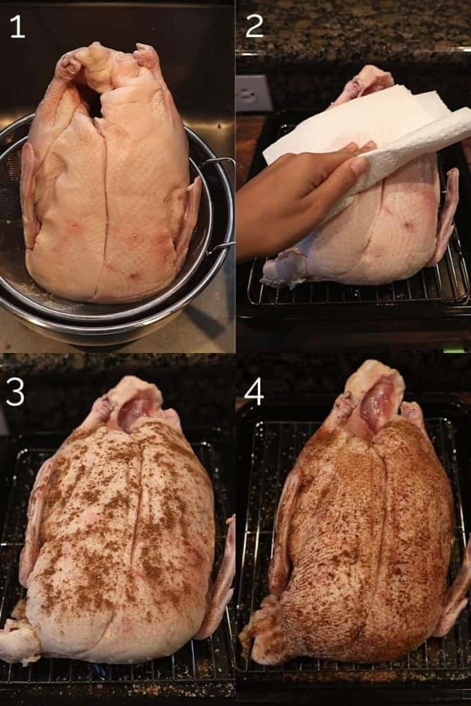 drying whole duck off with paper towel and rubbing chinese five spice on skin