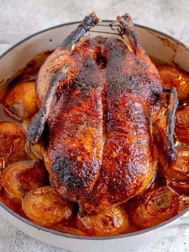 roasted duck over potatoes