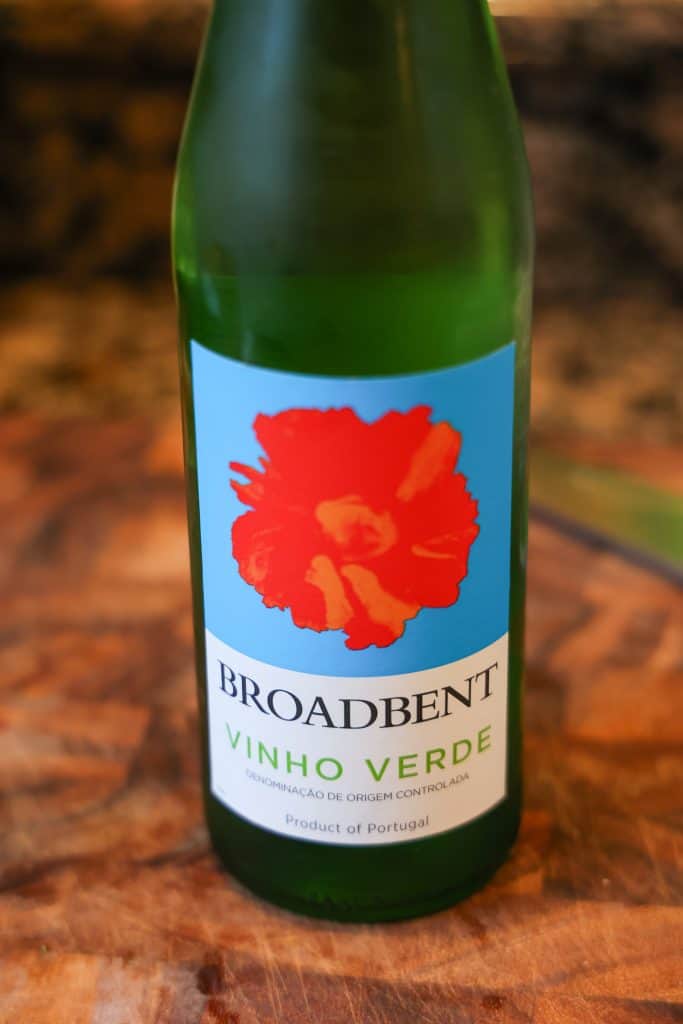 bottle of portuguese vinho verde on a wooden cutting board