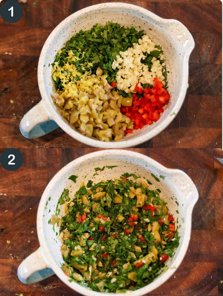 chopped olive chimichurri in a white bowl on a wooden cutting board