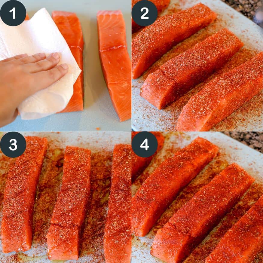 seasoning salmon with blackening seasoning on a cutting board